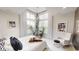 Bright bedroom with vaulted ceilings, large windows, and a serene view of the outdoors at 247 Poplar St, Westfield, IN 46074