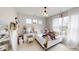 Cozy bedroom with a vanity and natural light streaming through large windows at 247 Poplar St, Westfield, IN 46074