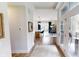 Welcoming entryway with hardwood floors leading to an open-concept kitchen and dining area at 247 Poplar St, Westfield, IN 46074