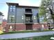 Townhouse exterior featuring brick, siding, balconies, and large windows that offer plenty of natural light at 247 Poplar St, Westfield, IN 46074