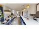 Bright open-concept kitchen with a large island, modern lighting, and adjacent dining area at 247 Poplar St, Westfield, IN 46074