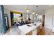 Bright eat-in kitchen featuring a large island, modern lighting, and breakfast area with a view at 247 Poplar St, Westfield, IN 46074