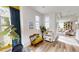 Bright living area with hardwood floors, natural light, and stylish eclectic decor at 247 Poplar St, Westfield, IN 46074