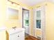 Bright bathroom with a single vanity, window, and patterned flooring at 2526 Dell Zell Dr, Indianapolis, IN 46220