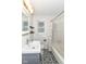 Updated bathroom with patterned tile floor and modern vanity at 2526 Dell Zell Dr, Indianapolis, IN 46220