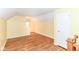 Spacious bedroom with hardwood floors, yellow walls, and a window at 2526 Dell Zell Dr, Indianapolis, IN 46220