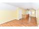 Bonus room with hardwood floors, ceiling fan and stair access at 2526 Dell Zell Dr, Indianapolis, IN 46220