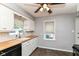 Bright kitchen featuring white cabinets, butcher block countertops, and tile flooring at 2526 Dell Zell Dr, Indianapolis, IN 46220