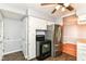 Kitchen featuring stainless steel refrigerator, black appliances, white cabinets and tile floors at 2526 Dell Zell Dr, Indianapolis, IN 46220