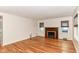 Sunlit living room showcasing hardwood floors and a fireplace at 2526 Dell Zell Dr, Indianapolis, IN 46220