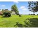 Spacious backyard with lush lawn and views of the surrounding farmland at 25420 Jerkwater Rd, Sheridan, IN 46069