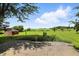 Picturesque backyard view from patio showcasing lush greenery, open space, and peaceful outdoor setting at 25420 Jerkwater Rd, Sheridan, IN 46069