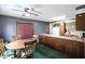 View of dining area from the kitchen, showcasing a table, chairs, and kitchen bar at 25420 Jerkwater Rd, Sheridan, IN 46069