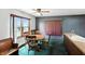 Dining area with a round wooden table, four chairs, and natural light from the window at 25420 Jerkwater Rd, Sheridan, IN 46069