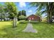 Charming brick house with a well-maintained lawn and garden, creating a welcoming and picturesque setting at 25420 Jerkwater Rd, Sheridan, IN 46069