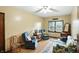 Comfortable living room featuring blue armchairs, a floral sofa, and a bright window at 25420 Jerkwater Rd, Sheridan, IN 46069