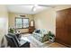 Inviting living room with a floral sofa, armchair, and natural light from a large window at 25420 Jerkwater Rd, Sheridan, IN 46069