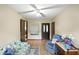 Cozy living room with a floral sofa, plush armchair, wood-look floors, and a ceiling fan at 25420 Jerkwater Rd, Sheridan, IN 46069