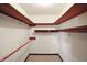 Functional walk-in closet with white walls, carpet, and basic wooden shelving at 25420 Jerkwater Rd, Sheridan, IN 46069