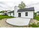 A new concrete patio is featured outside this home's sliding back door at 321 Virginia St, Fortville, IN 46040