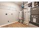 Basement mechanicals, including water heater, furnace, and utility connections at 321 Virginia St, Fortville, IN 46040