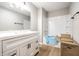 Bathroom features white vanity with drawers, a mirror, and a tub with new shower materials at 321 Virginia St, Fortville, IN 46040