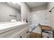 Bathroom featuring a white vanity, a bathtub with a shower, and unfinished fixtures at 321 Virginia St, Fortville, IN 46040