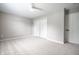 Bright bedroom with neutral walls, plush carpeting, and a convenient double-door closet at 321 Virginia St, Fortville, IN 46040