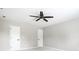 Bedroom with plush carpet featuring two doors and a ceiling fan at 321 Virginia St, Fortville, IN 46040