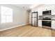 Spacious kitchen featuring stainless steel appliances and light wood flooring at 321 Virginia St, Fortville, IN 46040