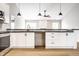 Open kitchen layout with a breakfast bar overlooking the adjacent living space at 321 Virginia St, Fortville, IN 46040