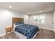 Cozy bedroom with carpet flooring, natural light, and wooden headboard at 326 Parkway Ave, Indianapolis, IN 46225