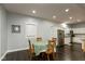 Dining area flows into a modern kitchen with stainless steel appliances and plenty of cabinet space at 326 Parkway Ave, Indianapolis, IN 46225