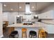 Beautiful kitchen with white cabinets, granite countertops, stainless steel appliances, and a large island with seating at 326 Parkway Ave, Indianapolis, IN 46225