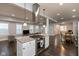 Open concept featuring the kitchen island looking over the living room with plenty of windows for natural light at 326 Parkway Ave, Indianapolis, IN 46225