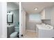 Convenient laundry room features new washer and dryer next to bathroom at 326 Parkway Ave, Indianapolis, IN 46225
