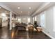 Spacious living room and kitchen combination, perfect for entertaining, and features dark hardwood floors and gray walls at 326 Parkway Ave, Indianapolis, IN 46225
