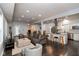 Open living area leading to a kitchen with a breakfast bar and stainless steel appliances at 326 Parkway Ave, Indianapolis, IN 46225