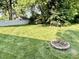 Expansive back yard has plenty of room to roam; bordered by a white privacy fence at 3321 Sycamore Dr, Columbus, IN 47203