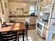 Compact kitchen shows plentiful countertop space, white appliances, and natural wood cabinetry at 3321 Sycamore Dr, Columbus, IN 47203