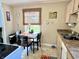 Charming kitchen eating area next to the sink features a view of the backyard at 3321 Sycamore Dr, Columbus, IN 47203