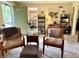 Cozy living room with seating, neutral carpeting, and views into the dining and kitchen area at 3321 Sycamore Dr, Columbus, IN 47203