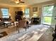 Inviting living room featuring a large window and neutral carpeting with a view to the home's entrance at 3321 Sycamore Dr, Columbus, IN 47203