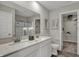 This bathroom has a double sink vanity, walk-in closet and gray ceramic tile flooring at 3794 Cantebury Dr, Franklin, IN 46131