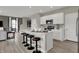 Gorgeous kitchen boasts an island with bar stool seating, modern appliances, and opens to the living area at 3794 Cantebury Dr, Franklin, IN 46131