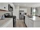 Contemporary kitchen with stainless steel appliances, white cabinetry, and island with breakfast bar at 3794 Cantebury Dr, Franklin, IN 46131