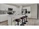 Beautiful kitchen features white cabinets, stainless steel appliances, and a spacious quartz countertop island with seating at 3794 Cantebury Dr, Franklin, IN 46131