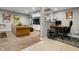 Open basement area featuring a comfortable couch, entertainment center, and a workstation at 4013 Hillendale Dr, Greenwood, IN 46142