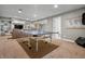 Spacious finished basement with a ping pong table, built-in shelves, and cozy seating area at 4013 Hillendale Dr, Greenwood, IN 46142