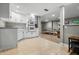 Basement kitchenette area adjacent to a recreation space, complete with tile flooring at 4013 Hillendale Dr, Greenwood, IN 46142